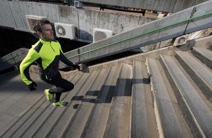 man jogging on steps photo
