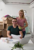 Young couple moving in a new home photo