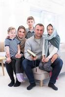 portrait of young happy modern muslim family photo