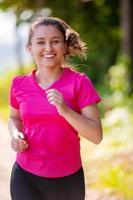 woman jogging on sunny day at nature photo