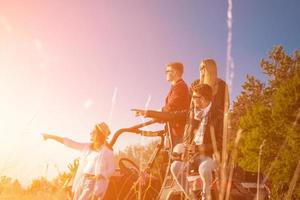 group of young people driving a off road buggy car photo