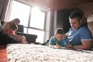 young couple spending time with kids photo