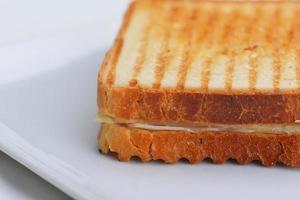 sandwich on a white surface photo