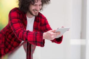 young freelancer using tablet computer photo