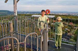 Boys with pinwheel at watch tower. photo