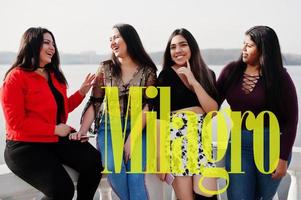 San Francisco de Milagro city. Group of four happy and pretty latino girls from Ecuador. photo