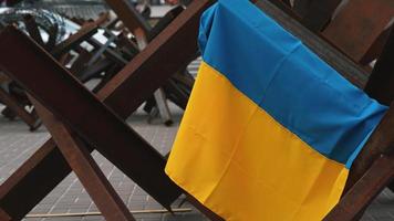 Ukrainian flag hangs on metal structure in Kyiv Ukraine video