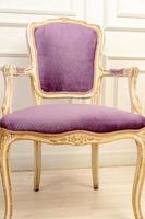 Purple Vintage classical farbirc style Chair indoors. photo