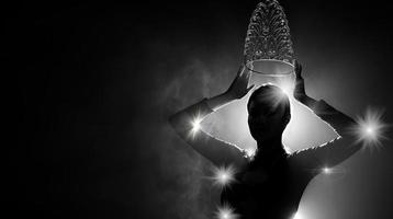 Silhouette abstract of two hands try to reach Diamond Crown as Miss Beauty Queen Pageant Contest as final competition, finale winner moment. Backlit smoke low exposure dark background copy space photo