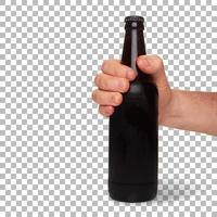 Man 's hand hold cold brown bottle beer isolated. photo