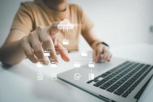 Officer using laptop manage files, Document Management System DMS, Online document database management, automated processes to manage system, ERP enterprise efficient, business technology. photo