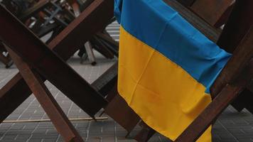 Ukrainian flag hangs on metal structure in Kyiv Ukraine