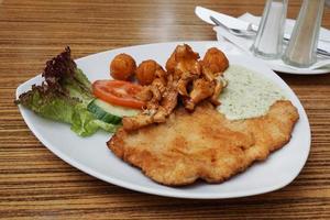 Schnitzel with chanterelles photo