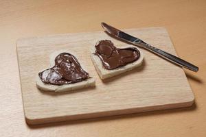 heart shaped toast slices with chocolate spread photo