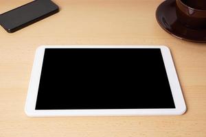 Tablet PC con pantalla en blanco en el escritorio foto