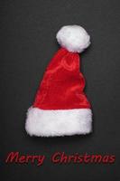 santa claus hat with merry christmas greeting photo