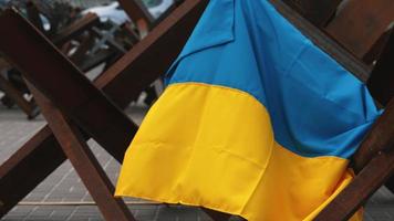 Ukrainian flag hangs on metal structure in Kyiv Ukraine video