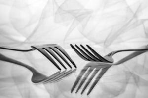 Two forks and reflection photo