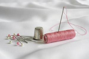 Needle,pins,coil and thimble photo