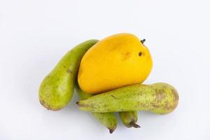 yellow mango fruit, green pear on a white background. ECO, environmentally friendly product. Copy space. photo