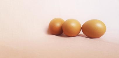 Eggs on a pink cloth. photo