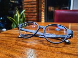 Glasses on a wooden table. photo