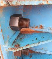 Close up photo of bolt and nut connection that joins steel plate for launcher gantry.