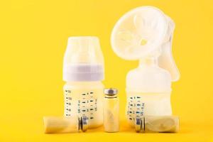 Bubbles, ampoules with dry probiotic, bifidobacteria, with probiotic powder inside on a yellow background. Copy space. photo