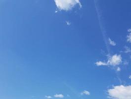 Clear blue sky with few clouds. photo