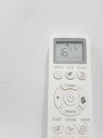 A white air conditioner remote on a white background. photo