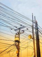 Photo of messy electric poles and power lines.