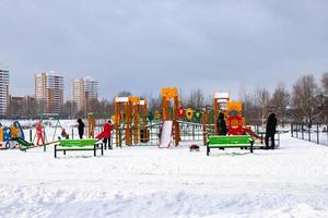 Children playground on a frosty winter day.