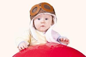 Baby aviator, in pilot hat, close up portrait, isolated on white background photo