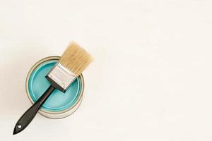 Paint cans and paint brushes and how to choose the perfect interior paint color and good for health photo