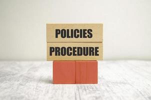policies procedure words on wooden blocks and white background photo