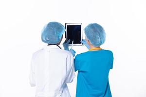 Full length Professional physician Doctor stand in hospital uniform discuss patient chart condition on Tablet. Woman Practitioner wear coat confident in clinic, isolated white background photo