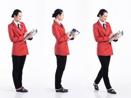 Full length 20s young Mix Race Woman business  financial accountant, working hard stress, wear formal blazer tie and shoes. Office female stands feels emotion over white background isolated photo