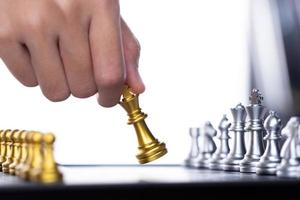 Business woman play Chess to success. Leader use strategy game to challenge competitor with intelligence leadership  power to move King to victory with management team idea battle to win, copy space photo