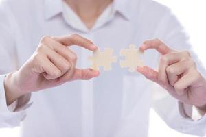 Business Woman solve puzzle as connect to strategy success idea and problem. Work as team match challenge and join company together in game for incomplete fit service, copy space white clean photo
