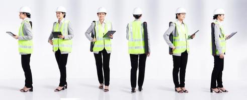 Full length 20s young Mix Race engineer architect client Woman, 360 front side rear back, wear safety vast hardhat tablet. Office female stands feels smile happy over white background isolated photo