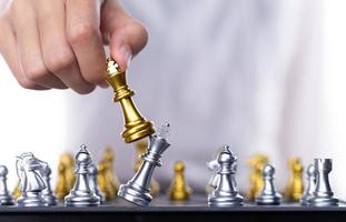 Business woman play Chess to success. Leader use strategy game to challenge competitor with intelligence leadership  power to move King to victory with management team idea battle to win, copy space photo