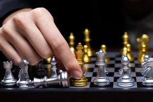 Business woman play Chess with close up Hand. Leader use strategy game to challenge competitor with intelligence leadership to move King to victory with management team idea fight, copy space photo