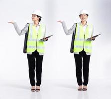 Full length 20s young caucasian engineer architect client Woman, showing empty palm hand, wear safety vast hardhat tablet. Office female stands feels smile happy over white background isolated photo