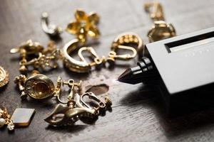 Many expensive decorative Ring, Earrings ready to check real or not with Diamond Tester Gemstone Selector Gems LED Indicator Jewelry kits Test, Portable electronic device to peep quick selective focus photo