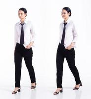 Full length 20s young Mix Race Woman  bartender worker employee, walking forward left right, wear formal necktie and shirt. Office female stands feels stress over white background isolated photo