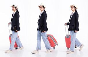 Full length 20s young Mix Race traveller guide tour Woman, walking forward left right with luggage, wear camera jeans hat. Tourist female travels feels smile happy over white background isolated photo