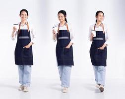 Full length 20s young Mix Race Barista shop restaurant Woman, walking forward left right, wear apron coffee cup. Office female stands feels smile happy over white background isolated photo