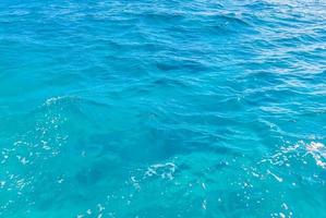 Blue turquoise water waves ocean and sea texture pattern Mexico. photo