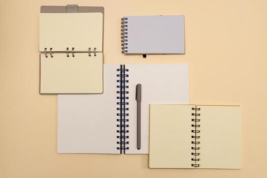 plenty of open notebooks made from recycled paper. Stationery mock up template for your design. View from above. Flat lay photo