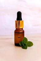 Aromatherapy Aroma Scented Oil in Glass Bottle with Mint photo